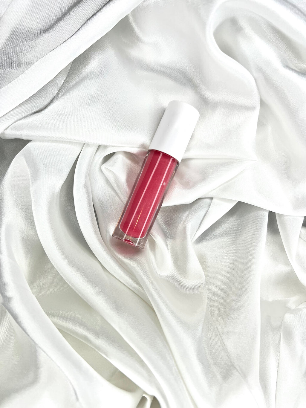 Raspberry "K" tinted lip gloss